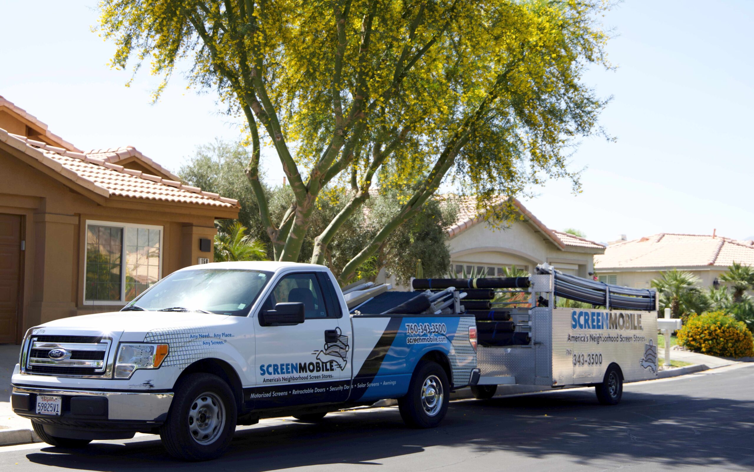 Screenmobile franchise truck and trailer parked infront of home