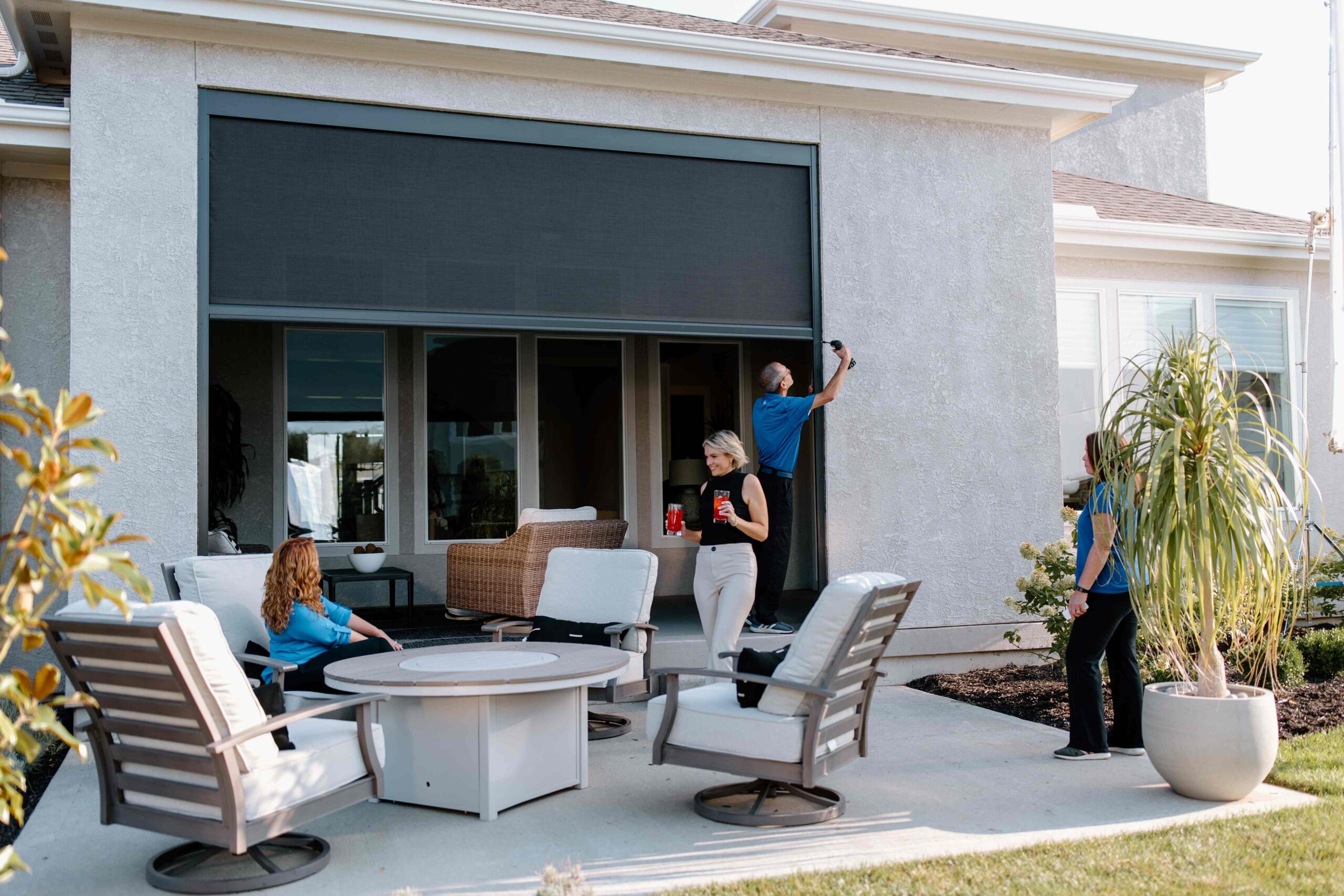 Screenmobile franchise owner installing screen for customer backyard