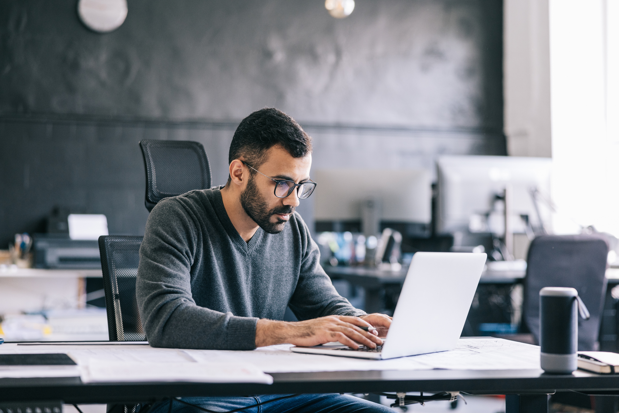 Man working on laptop in office